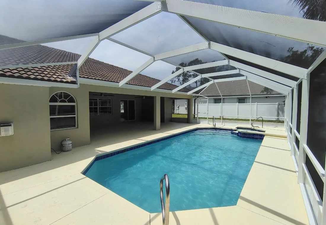 Freshly cleaned pool deck and screen enclosure exterior
