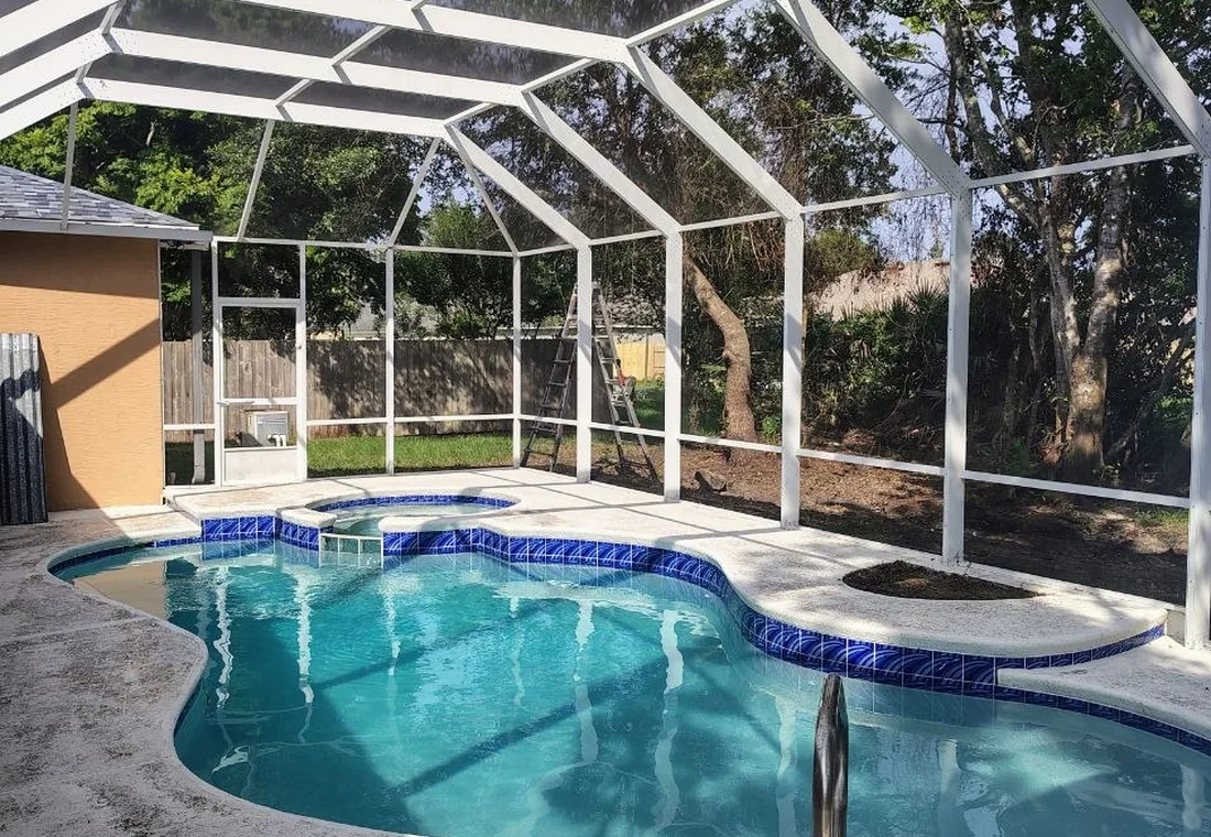 Clean blue swimming pool after weekly pool service